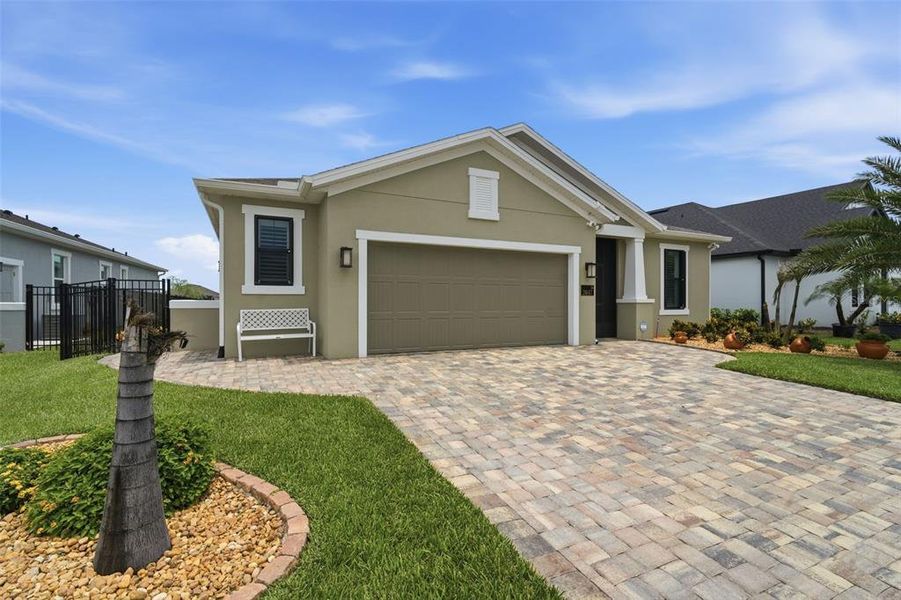 Front exterior of a new home in , Melbourne, FL, highlighting curb appeal (Image 26). Front exterior of a new home in , Melbourne, FL, highlighting curb appeal (Image 26).