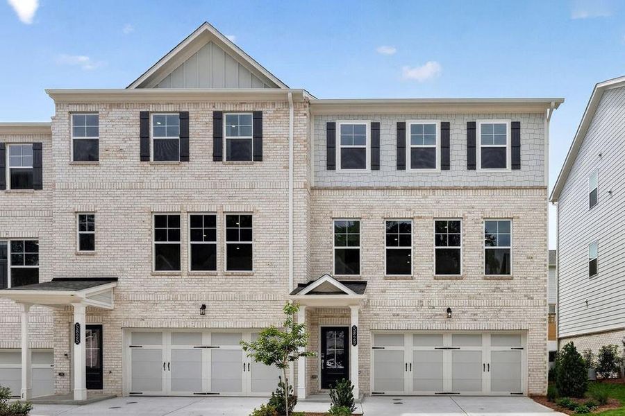 Front exterior of a new home in Somerset at Veterans Memorial, Mableton, GA, highlighting curb appeal (Image 2). Front exterior of a new home in Somerset at Veterans Memorial, Mableton, GA, highlighting curb appeal (Image 2).