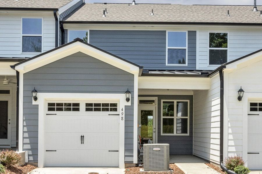 Front exterior of a new home in Enclave at Traditions Townhomes, Wake Forest, NC, highlighting curb appeal (Image 16).
