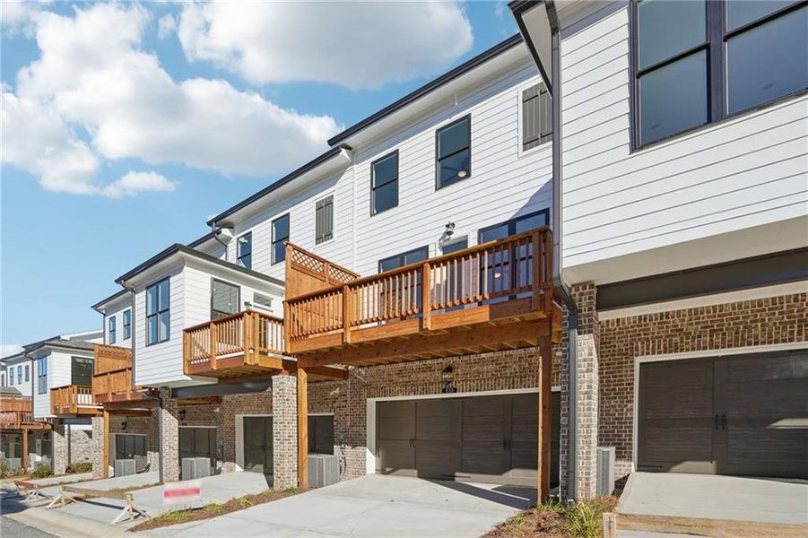 Exterior details and patio area of a home in Palisades Townhomes, Cumming (Image 20).