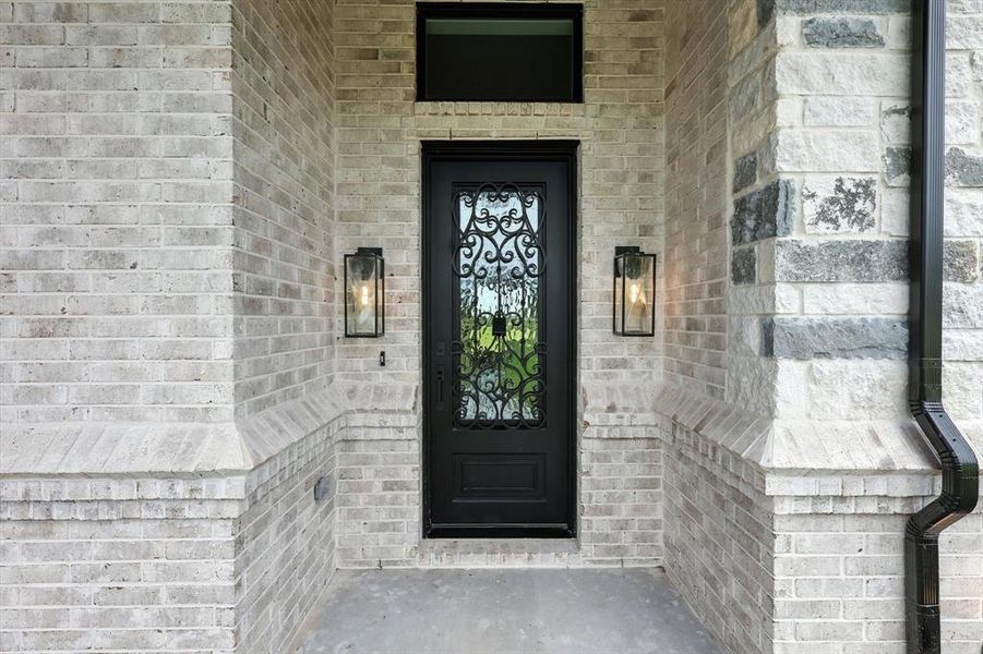 Entrance to property featuring brick siding Entrance to property featuring brick siding
