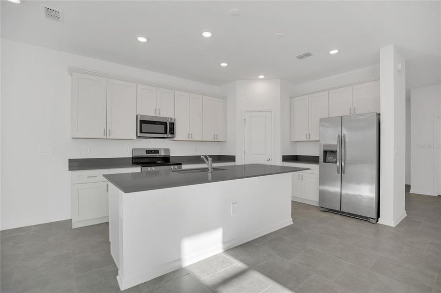 Furnished interior view inside a new home in Rhett's Ridge: Estates Alley Collection, Apopka (Image 11). Furnished interior view inside a new home in Rhett's Ridge: Estates Alley Collection, Apopka (Image 11).