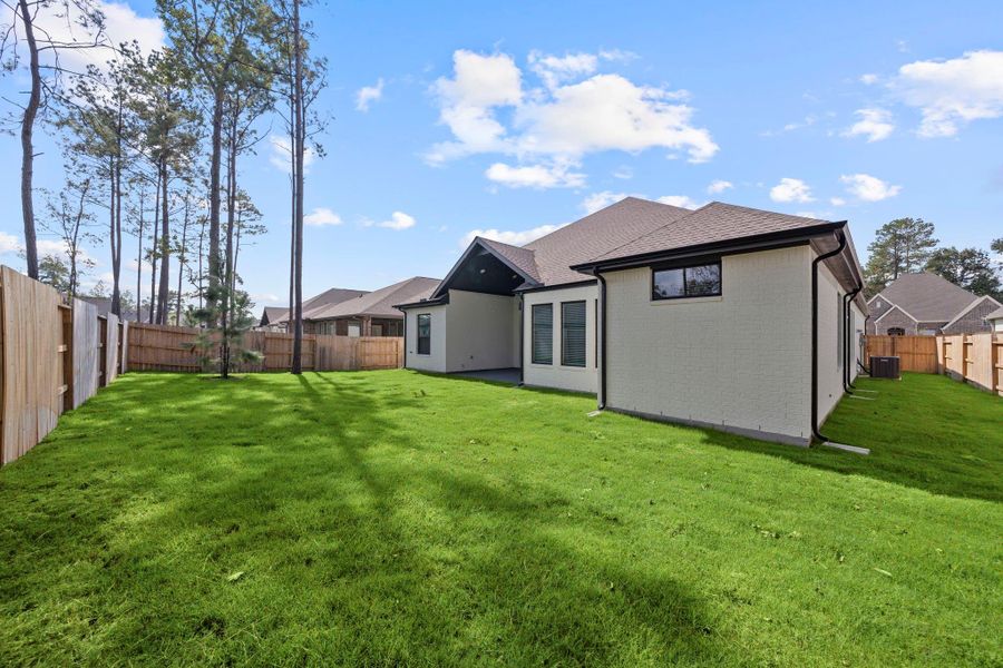 Exterior details and patio area of a home in Evergreen, Conroe (Image 3). Exterior details and patio area of a home in Evergreen, Conroe (Image 3).