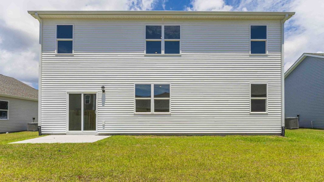 Exterior details and patio area of a home in Cedar Hill Landing, Navassa (Image 18). Exterior details and patio area of a home in Cedar Hill Landing, Navassa (Image 18).
