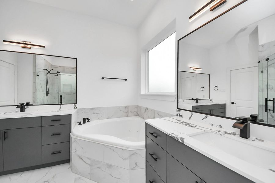 This modern bathroom with quartz countertops, a spacious corner tub, and a glass-enclosed shower, all set against a bright, airy backdrop. This modern bathroom with quartz countertops, a spacious corner tub, and a glass-enclosed shower, all set against a bright, airy backdrop.