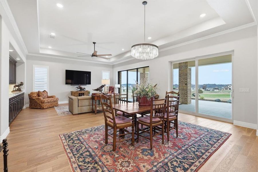 Perfectly situated between the Great Room and Gourmet Cook’s Kitchen, this Refined Dining Space features its own Double Sliding Glass Doors and Effortless Access to the Outdoor Pavilion Designed for Seamless Entertaining and offers an Elegant Setting for both Intimate Dinners and Grand Gatherings.