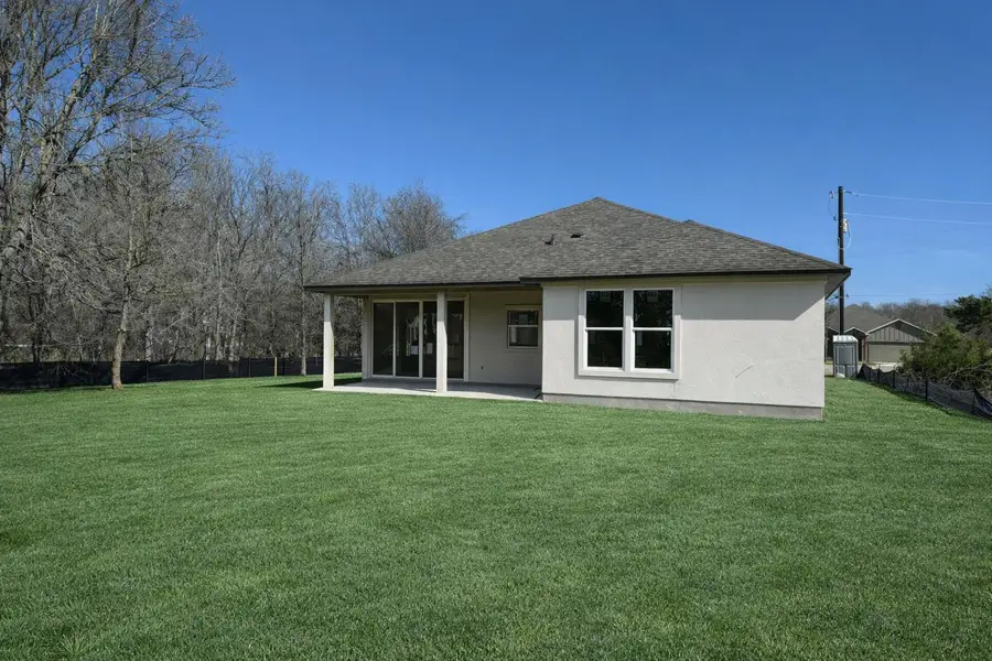 Rear view of property featuring a patio area, Finished Virtual image of the home.