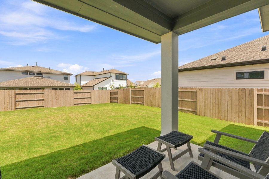 Covered back patio overlooking the expansive, fully fenced backyard—ideal for outdoor dining and relaxing. Covered back patio overlooking the expansive, fully fenced backyard—ideal for outdoor dining and relaxing.