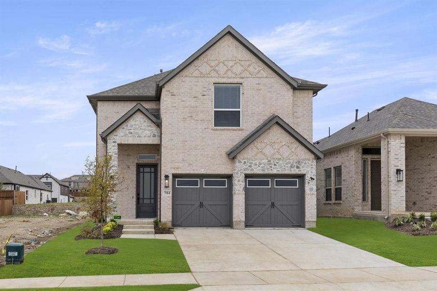 Front exterior of a home in the The Villages of Hurricane Creek community, located in Anna, TX (Image 1).