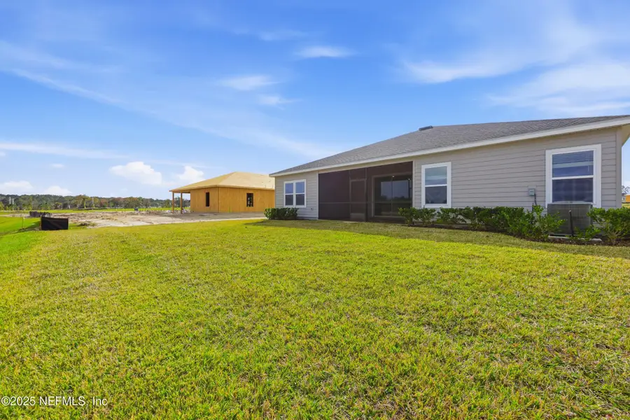 Exterior details and patio area of a home in Edenbrooke at Hyland Trail | 55+: Edenbrooke at Hyland Trail 60s, Green Cove Springs (Image 4). Exterior details and patio area of a home in Edenbrooke at Hyland Trail | 55+: Edenbrooke at Hyland Trail 60s, Green Cove Springs (Image 4).