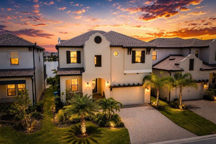 Front exterior of a new home in SouthShore Yacht Club, Ruskin, FL, highlighting curb appeal (Image 1). Front exterior of a new home in SouthShore Yacht Club, Ruskin, FL, highlighting curb appeal (Image 1).