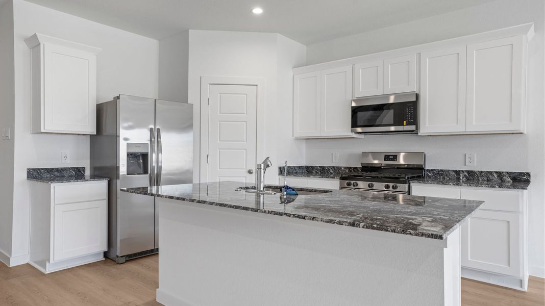 Representative furnished interior of a home built from the Mitchell by D.R. Horton in Caldwell Crossing, Iowa Colony (Image 5).