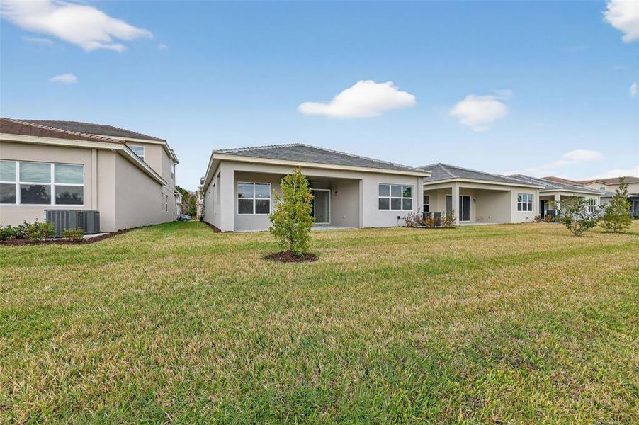Exterior details and patio area of a home in Winding Ridge, Wesley Chapel (Image 26).