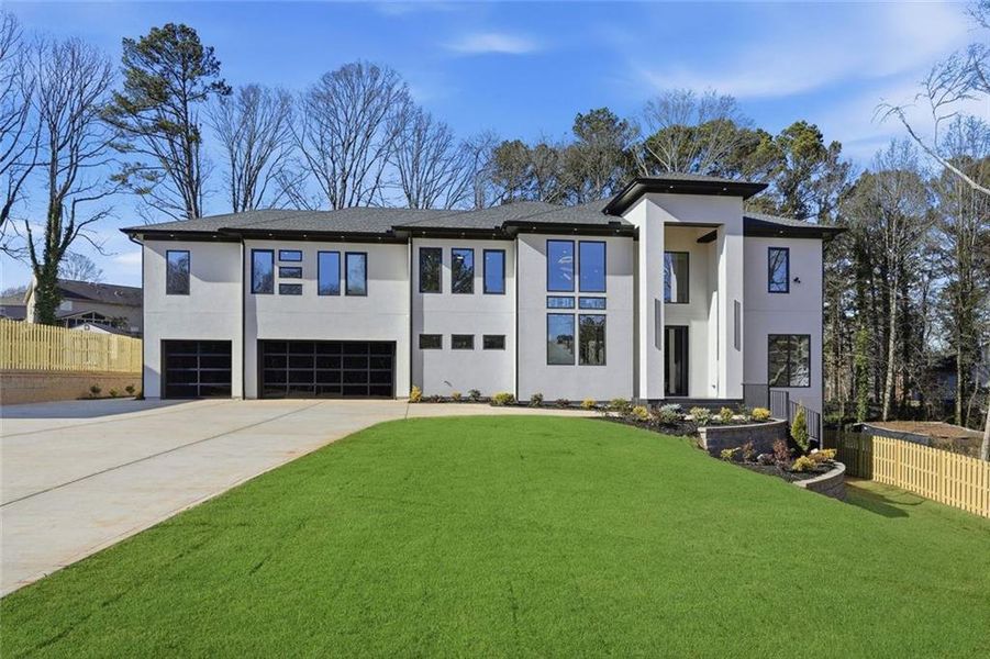 Front exterior of a new home in , Lawrenceville, GA, highlighting curb appeal (Image 2). Front exterior of a new home in , Lawrenceville, GA, highlighting curb appeal (Image 2).