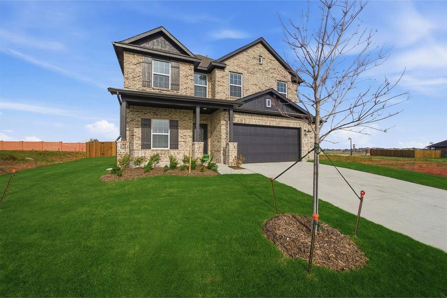 Front exterior of a new home in Saddlebrook Estates, Waxahachie, TX, highlighting curb appeal (Image 2).