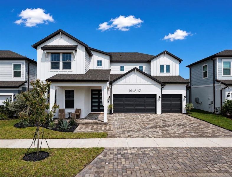 Front exterior of a new home in , Apollo Beach, FL, highlighting curb appeal (Image 23). Front exterior of a new home in , Apollo Beach, FL, highlighting curb appeal (Image 23).