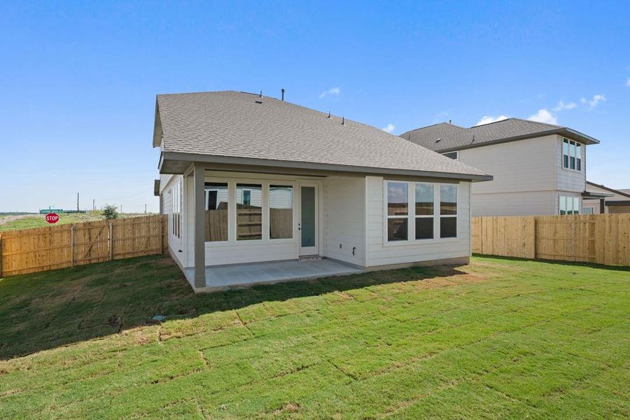 Exterior details and patio area of a home in Terrace Collection At Turner's Crossing, Buda (Image 27).