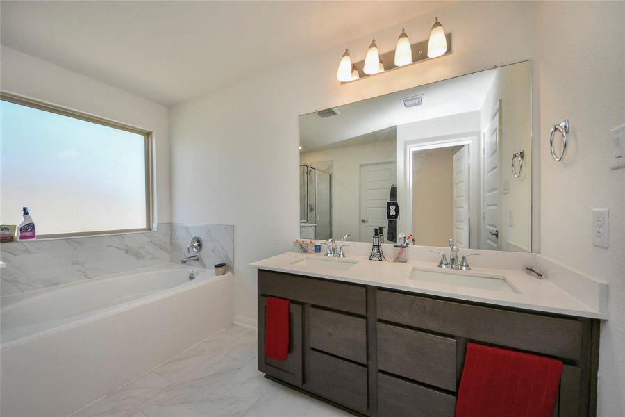 Furnished interior view inside a new home in Sunterra North, Katy (Image 29).