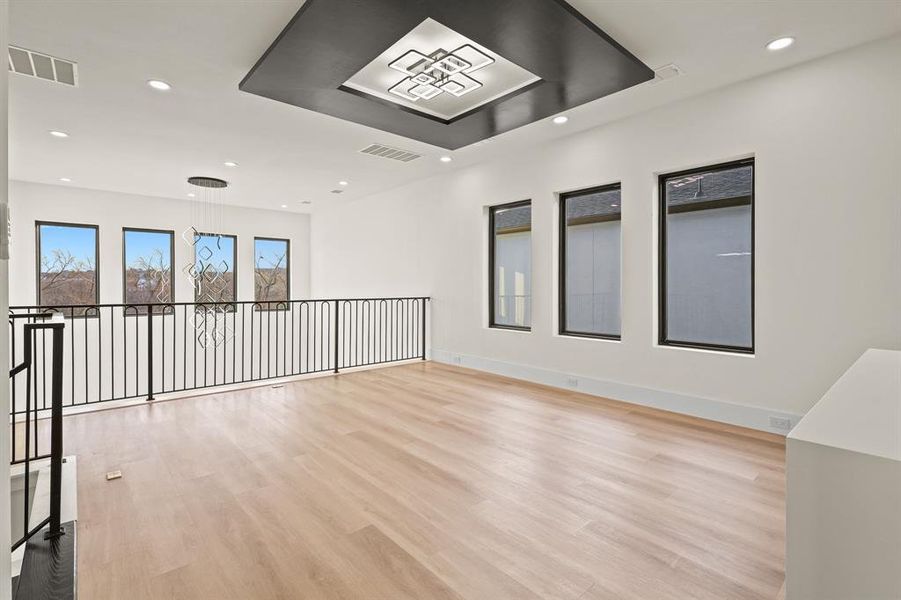 Unfurnished room featuring light wood-type flooring