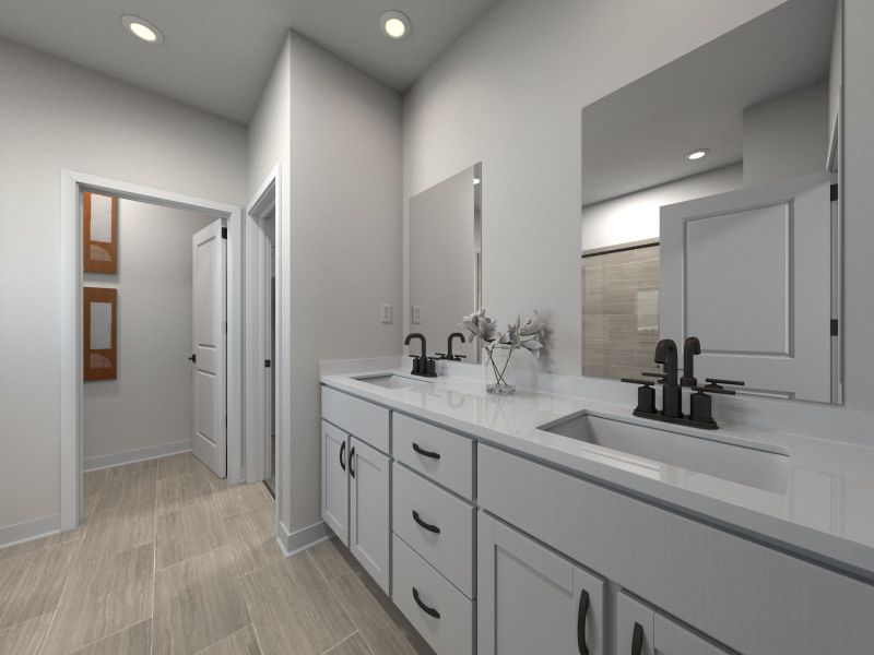 The primary bathroom offers dual vanity sinks and a walk-in shower. The primary bathroom offers dual vanity sinks and a walk-in shower.