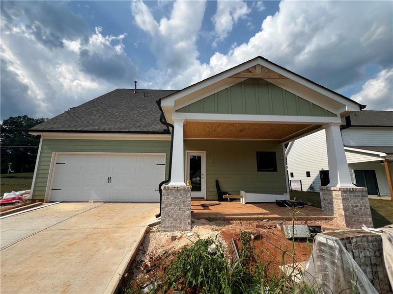 Front exterior of a new home in , Emerson, GA, highlighting curb appeal (Image 1).