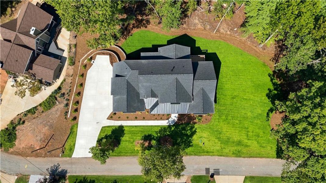 Front exterior of a new home in , Flowery Branch, GA, highlighting curb appeal (Image 2). Front exterior of a new home in , Flowery Branch, GA, highlighting curb appeal (Image 2).