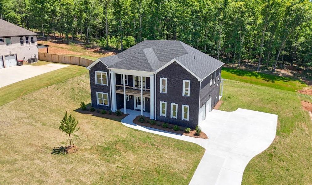 Front exterior of a new home in , Griffin, GA, highlighting curb appeal (Image 32).