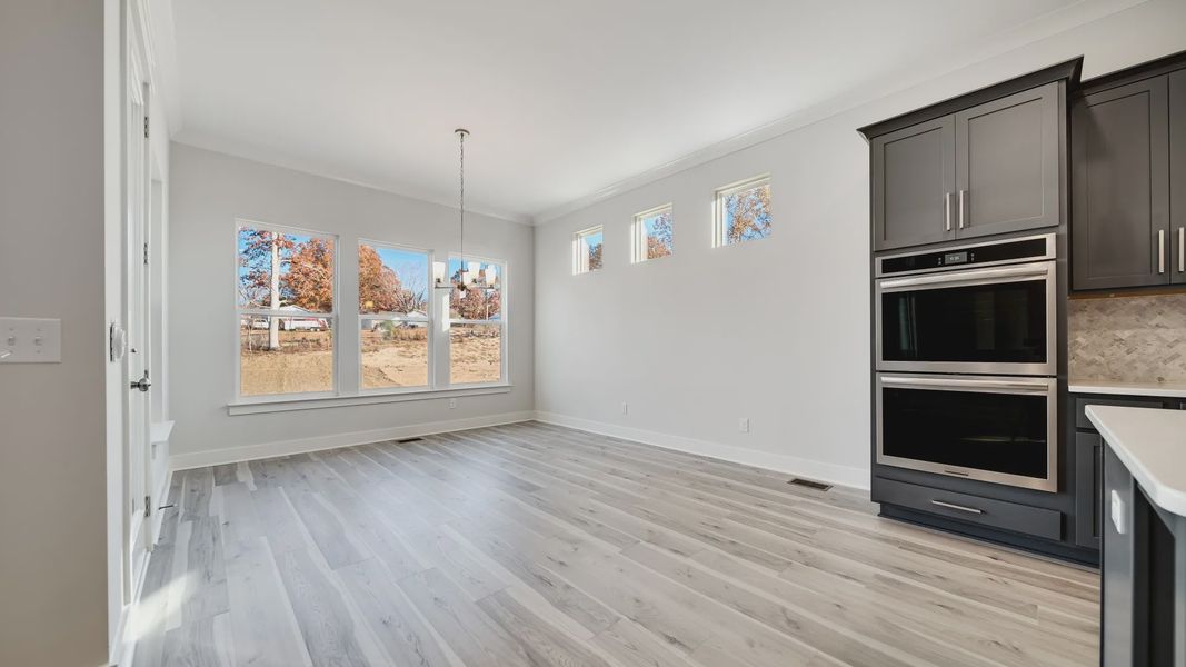 Open Dining area with large amount of natural light near the kitchen