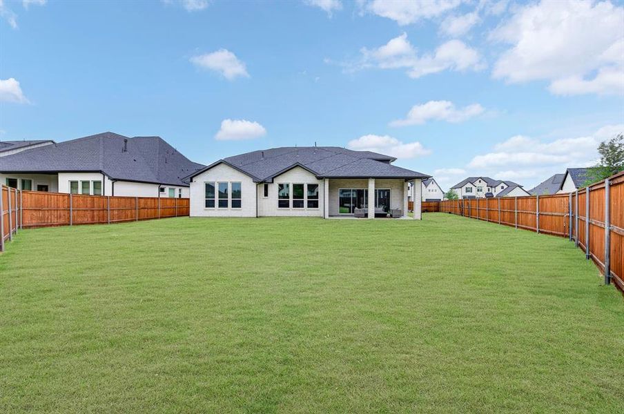 Exterior details and patio area of a home in Light Farms Graham/Reagan, Celina (Image 27).