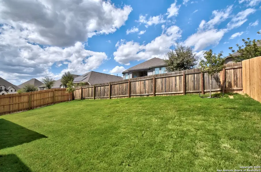 Exterior details and patio area of a home in Weston Oaks, San Antonio (Image 2).