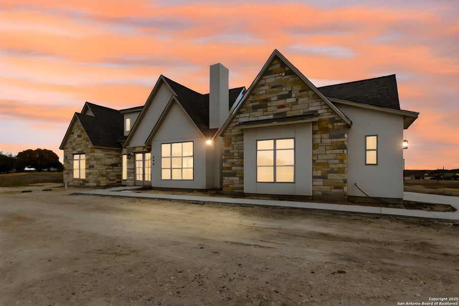 Front exterior of a new home in , Bandera, TX, highlighting curb appeal (Image 28).