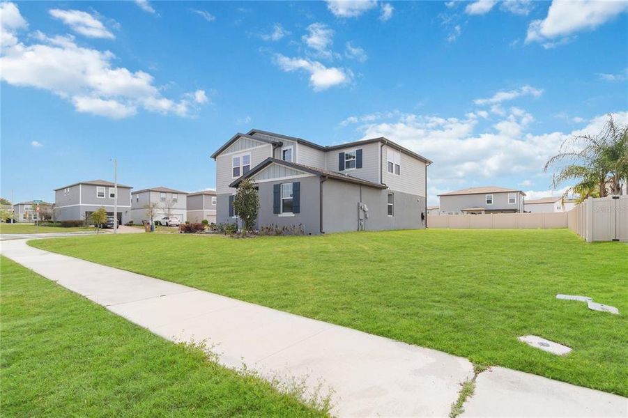 Front exterior of a new home in Silver Springs, St. Cloud, FL, highlighting curb appeal (Image 22). Front exterior of a new home in Silver Springs, St. Cloud, FL, highlighting curb appeal (Image 22).
