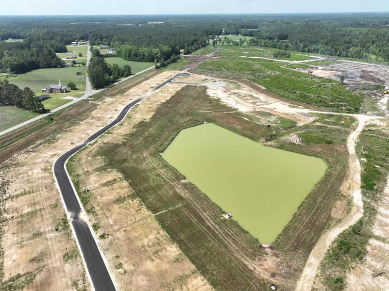 View of property location featuring a nearby body of water and rural landscape