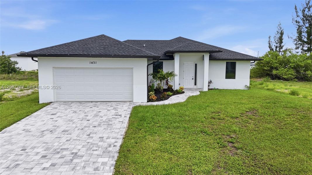 Front exterior of a new home in , Cape Coral, FL, highlighting curb appeal (Image 2). Front exterior of a new home in , Cape Coral, FL, highlighting curb appeal (Image 2).