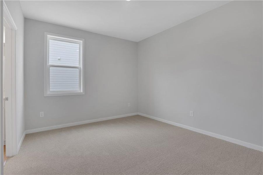 Spacious, unfurnished interior of a new home in The Paddocks at Doc Hughes, Buford (Image 33).