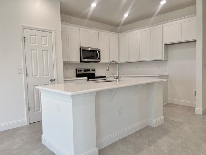 Furnished interior view inside a new home in Lakes At St Sebastian, Micco (Image 9).