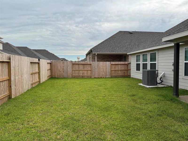 Fully fenced backyard offers green space for pets, play, and outdoor enjoyment. Fully fenced backyard offers green space for pets, play, and outdoor enjoyment.