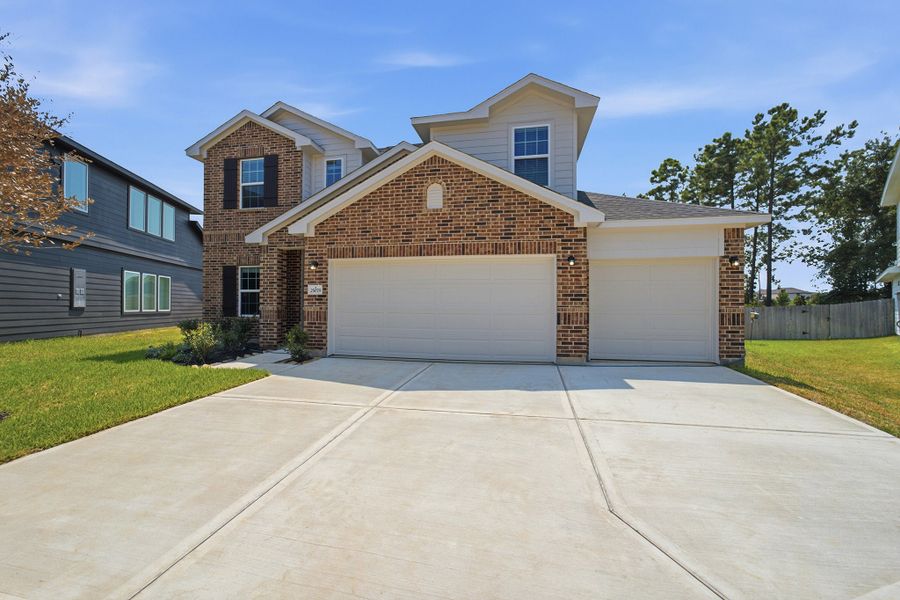 Front exterior of a new home in Magnolia Springs, Montgomery, TX, highlighting curb appeal (Image 23).