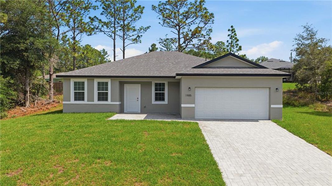 Front exterior of a new home in , Citrus Springs, FL, highlighting curb appeal (Image 22). Front exterior of a new home in , Citrus Springs, FL, highlighting curb appeal (Image 22).