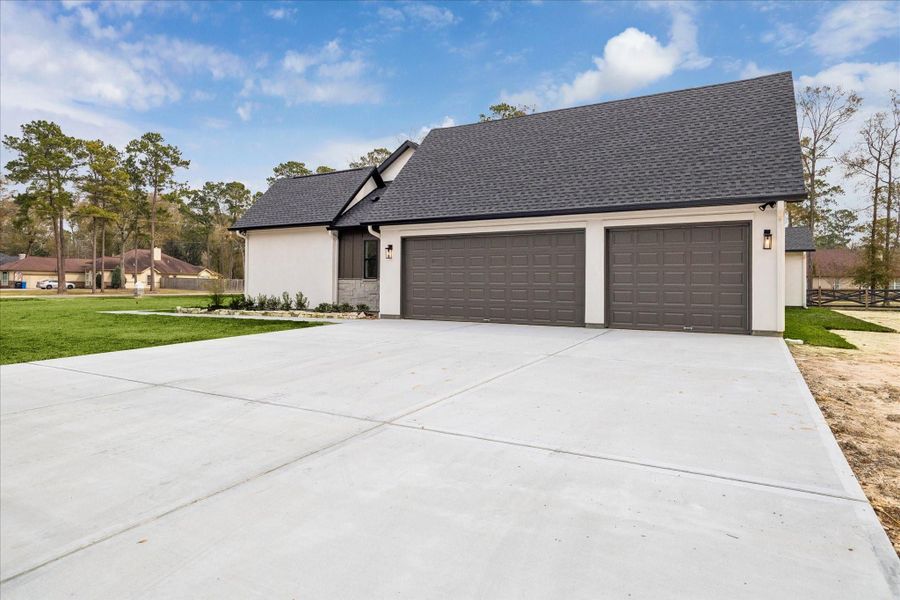 Front exterior of a new home in , Porter, TX, highlighting curb appeal (Image 27).