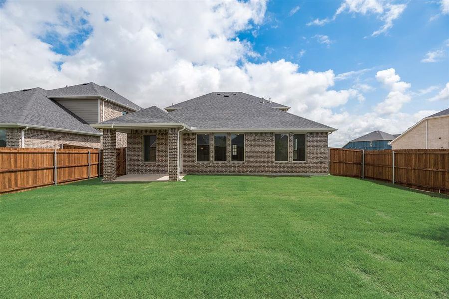 Front exterior of a new home in Sutton Fields, Celina, TX, highlighting curb appeal (Image 14).