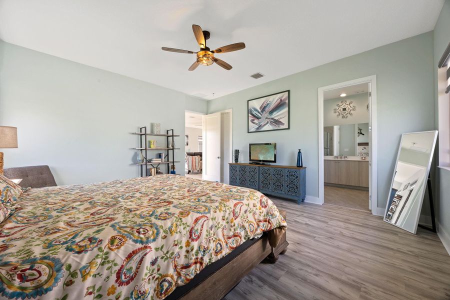 Bedroom with wood finished floors and ceiling fan