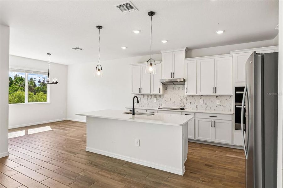 Furnished interior view inside a new home in The Grove at Stuart Crossing - Signature Series, Bartow (Image 11).