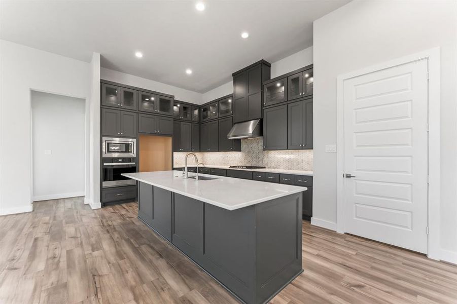 Kitchen with Stacked Cabinets, Gas Cooktop, Vent to Exterior, Cabinet Hardware, and So Much More!