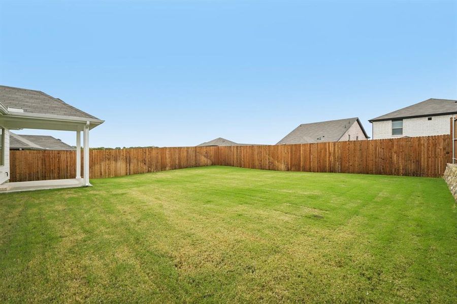 Exterior details and patio area of a home in Simpson Crossing - Signature Series, McKinney (Image 22). Exterior details and patio area of a home in Simpson Crossing - Signature Series, McKinney (Image 22).