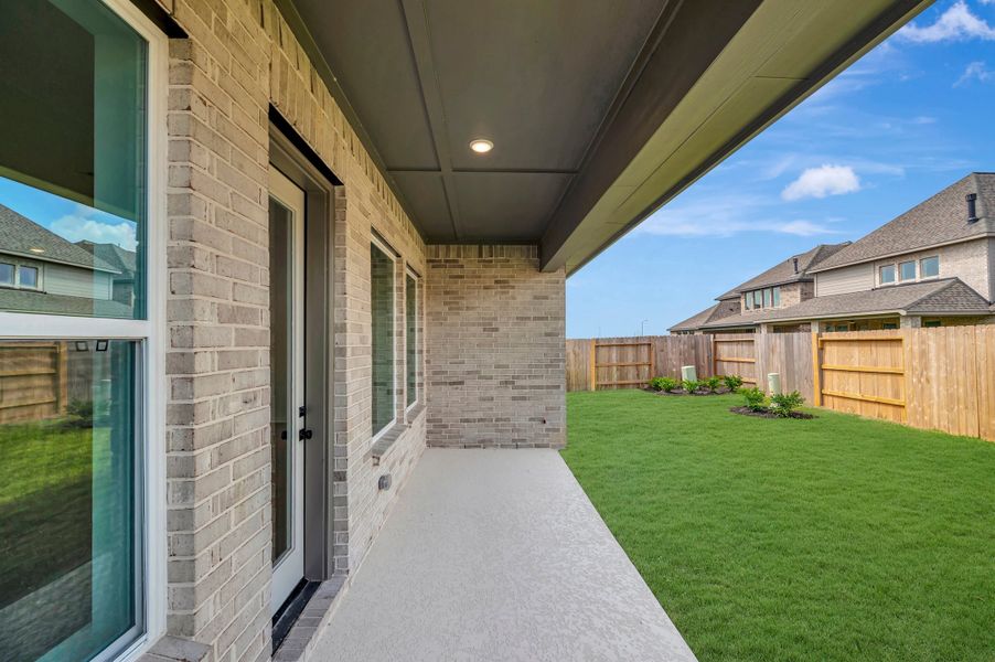 Exterior details and patio area of a home in The Grand Prairie - Retreat Collection, Hockley (Image 4).
