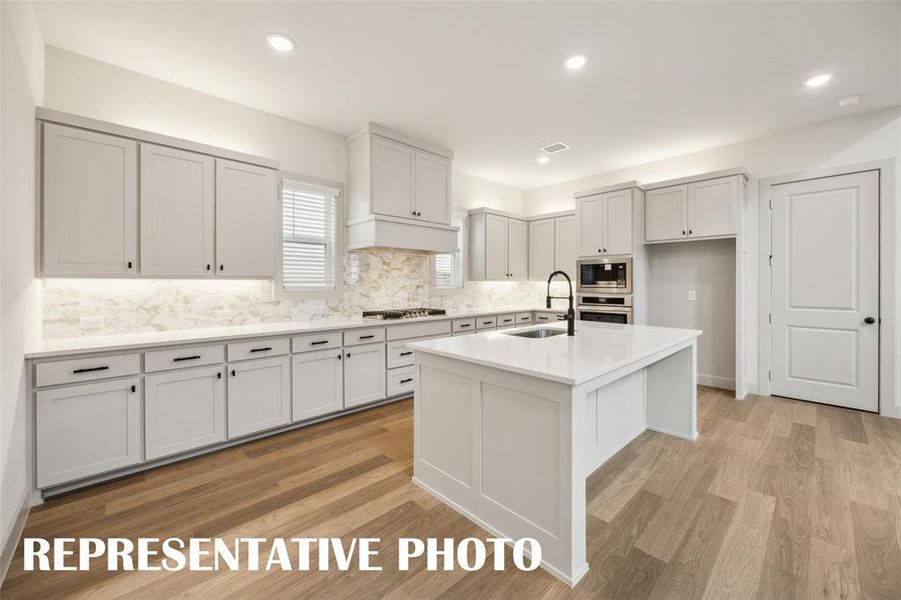 Featuring storage and prep space galore, the chef in the family will love creating culinary masterpieces in this dream kitchen!  REPRESENTATIVE PHOTO