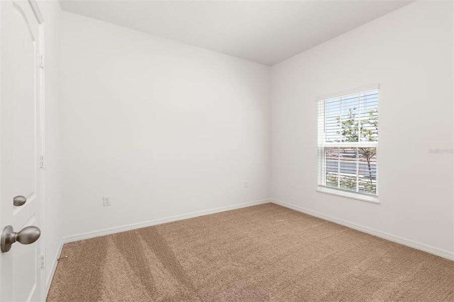 Spacious, unfurnished interior of a new home in Peach Crossings, Winter Haven (Image 18).