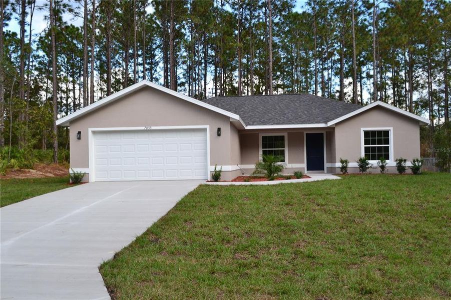 Front exterior of a new home in , Dunnellon, FL, highlighting curb appeal (Image 1).