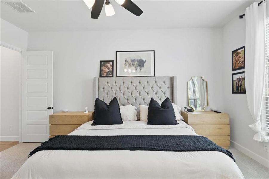 Bedroom featuring visible vents, ceiling fan, and baseboards